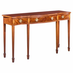 Antique-style wooden console table with three drawers and tapered legs, in warm brown finish.