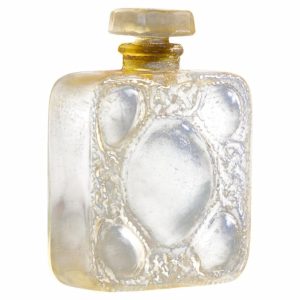 Decorative square glass bottle with embossed heart shapes and a tan stopper.